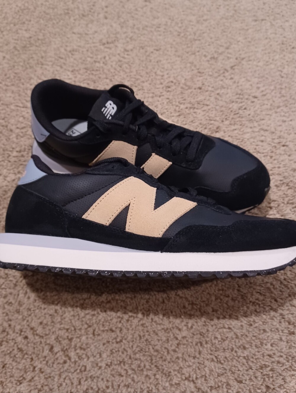 New Balance 237 sneakers, featuring a black upper Women's Size 10